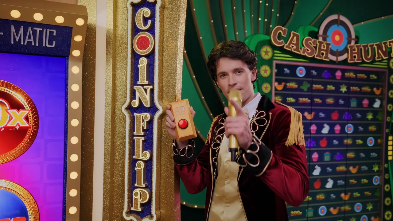 Crazy Balls Coin Flip bonus game: the host at the coin launcher